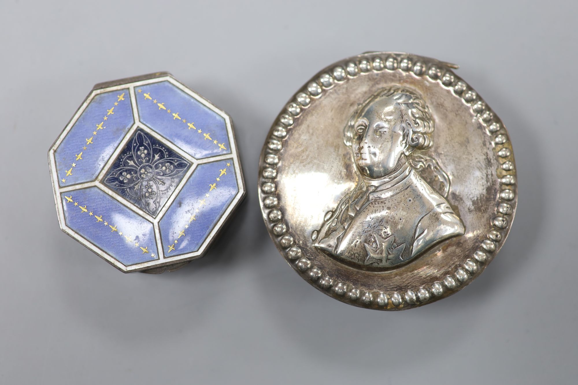A late 19th century Hanau silver circular snuff box, import marks for London, 1899, 71mm and a later silver box.